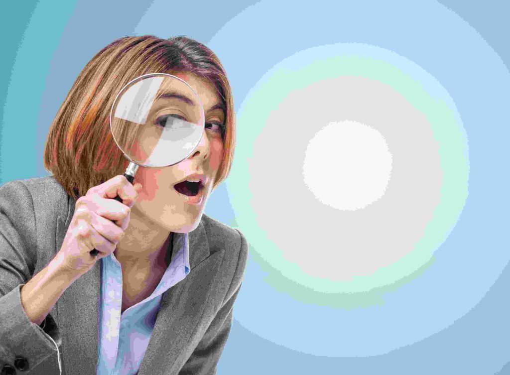 a lady with a magnifying glass